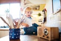 Toddler boy in dangerous situation at home. Child safety concept. Royalty Free Stock Photo