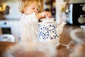 Toddler boy in dangerous situation at home. Child safety concept. Royalty Free Stock Photo