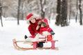 Toddler boy and his mother having fun in winter Royalty Free Stock Photo