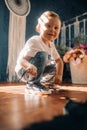 Toddler boy learns to tie the shoelaces on his sneakers Royalty Free Stock Photo