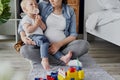 Toddler boy with lollipop and his pregnant mother Royalty Free Stock Photo