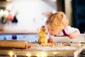 Toddler boy making gingerbread cookies at home. Royalty Free Stock Photo