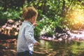 Toddler boy in nature near water Royalty Free Stock Photo