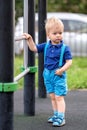 Toddler boy at playground wearing shorts and suspenders Royalty Free Stock Photo