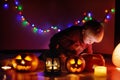 Toddler boy playing with halloween pumpkins indoors Royalty Free Stock Photo