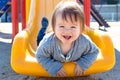 Toddler boy playing on the playground Royalty Free Stock Photo