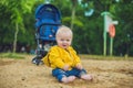 Toddler boy playing with sand on the beach development of fine m Royalty Free Stock Photo
