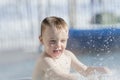 Toddler Boy Playing in a Warm Water Pool During the Winter Royalty Free Stock Photo