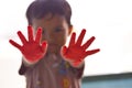 toddler boy shows both red palms Royalty Free Stock Photo