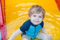 Toddler boy swimming, having fun and playing in water Royalty Free Stock Photo