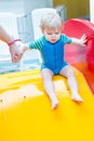 Toddler boy swimming, having fun and playing in water Royalty Free Stock Photo