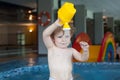 Toddler boy swimming, having fun and playing in water Royalty Free Stock Photo