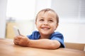 Toddler, boy and texting at home, happiness and communication with technology. Table, chatting and conversation for Royalty Free Stock Photo