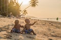 Toddler Boys Sitting on the beach Royalty Free Stock Photo