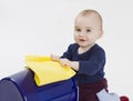 Toddler with bucket and floor cloth