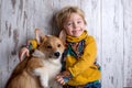 Toddler child and dog, boy and puppy playing together at home Royalty Free Stock Photo