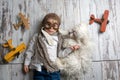 Toddler child and dog, boy and puppy playing together at home Royalty Free Stock Photo