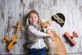 Toddler child and dog, boy and puppy playing together at home Royalty Free Stock Photo