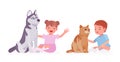 Toddler child, little boy, girl playing with pet dog, cat Royalty Free Stock Photo