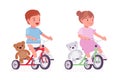 Toddler child, little boy, girl riding tricycle with teddy bear Royalty Free Stock Photo