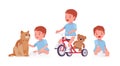 Toddler child, little boy riding tricycle, playing with pet cat Royalty Free Stock Photo