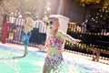 Toddler Child Running through Water Sprinklers at Outdoor Splash Park Royalty Free Stock Photo