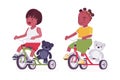 Toddler children, black little boy and girl enjoying riding tricycle