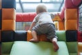 toddler climbing on a soft play jungle gym Royalty Free Stock Photo