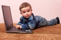 Toddler discovering a laptop Royalty Free Stock Photo