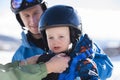 Toddler Dressed Safely for Skiing with Helmet & Harness