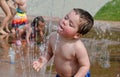 Toddler drinking in a summer fountain Royalty Free Stock Photo