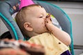 A toddler eating cake