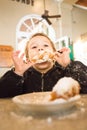 Toddler Enjoying Beignets at Cafe Du Monde Royalty Free Stock Photo