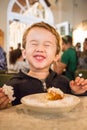 Toddler Enjoying Beignets at Cafe Du Monde Royalty Free Stock Photo