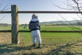 Toddler enjoying view into rural countryside in srping