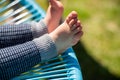 toddler feet in a chair. baby foot close up Royalty Free Stock Photo