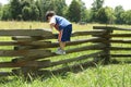 Toddler on Fence Royalty Free Stock Photo