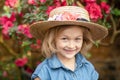 Toddler with flower basket. girl holding pink flowers Royalty Free Stock Photo