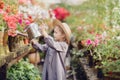 Toddler with flower basket. girl holding pink flowers Royalty Free Stock Photo