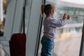 Toddler girl at airport in face mask