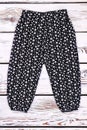 Toddler girl black printed trousers.