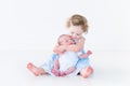 Toddler girl in blue dress kissing her newborn brother Royalty Free Stock Photo