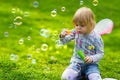 Toddler girl with butterfly wings having fun in park Royalty Free Stock Photo