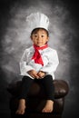 A toddler girl in chef cook attire portrait. Filipino-Asian girl.