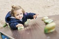 Toddler Girl Climbing A Wall In A Park Royalty Free Stock Photo