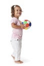 Toddler girl with a colored ball Royalty Free Stock Photo