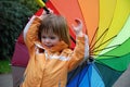 Toddler girl with colorful umbrella