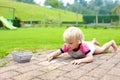 Toddler girl drawing with chalk outdoors Royalty Free Stock Photo