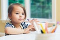 Toddler girl drawing and doing crafts Royalty Free Stock Photo