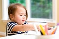 Toddler girl drawing and doing crafts Royalty Free Stock Photo